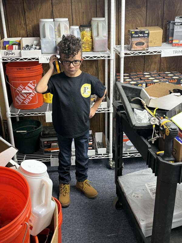 Kid holding phone to Contact JP3 Electric